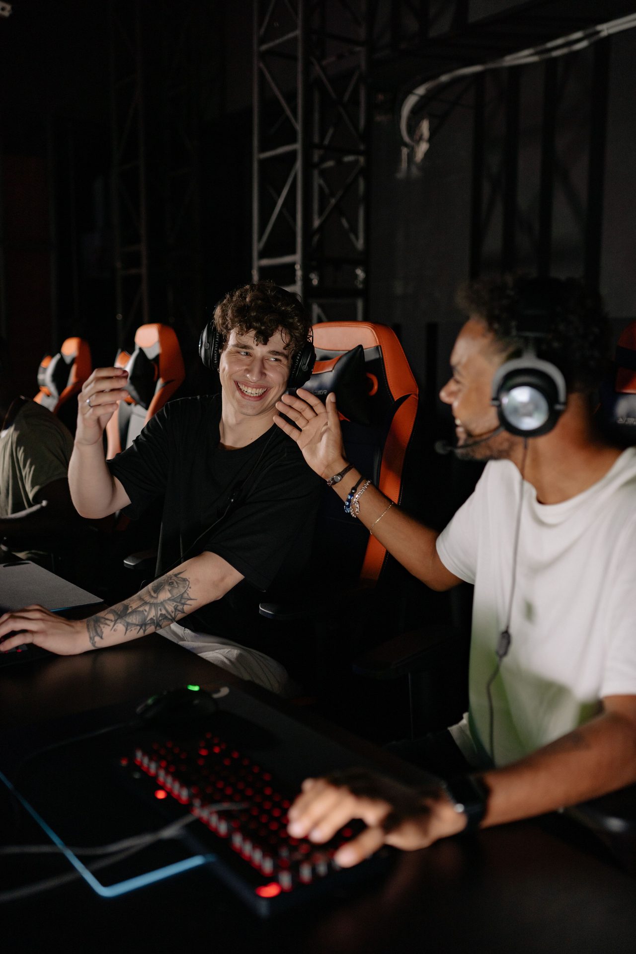 Two paired YOYO duo desks lit for co-op play after dark